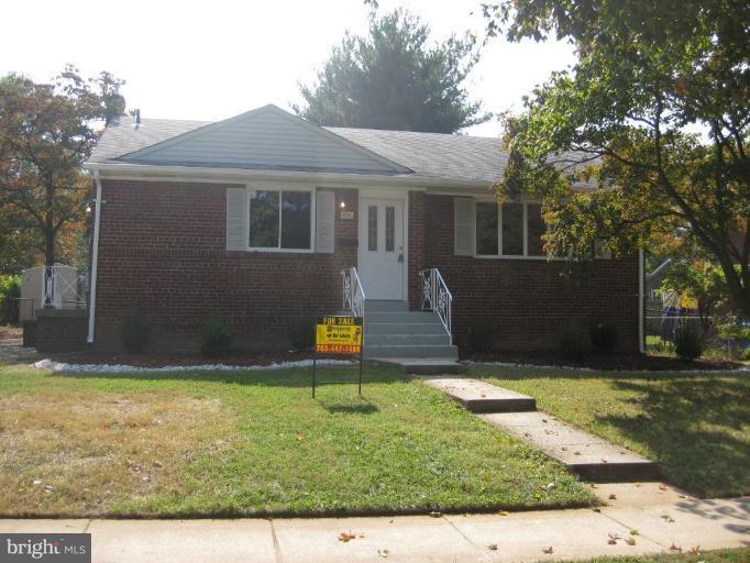408 Hannes Street Silver Spring, MD 20901 - Photo 1 of 10 a view of a house with backyard and a tree