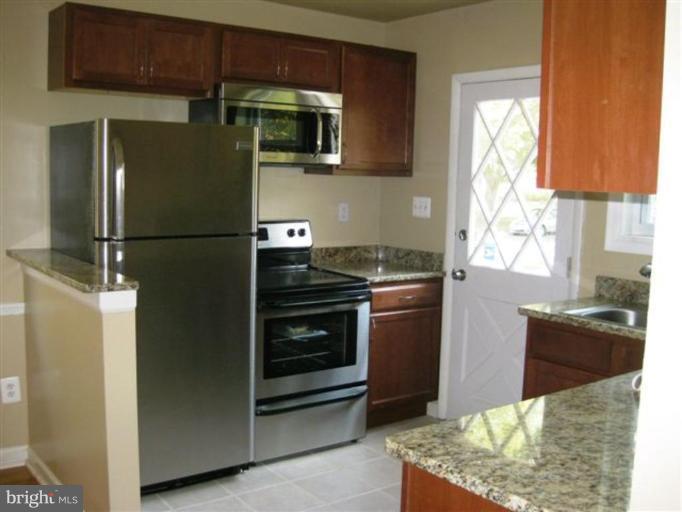 408 Hannes Street Silver Spring, MD 20901 - Photo 2 of 10 a kitchen with a refrigerator and a sink