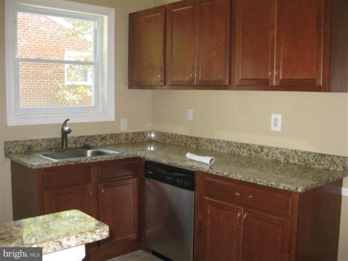 408 Hannes Street Silver Spring, MD 20901 - Photo 4 of 10 a kitchen with a sink and a window