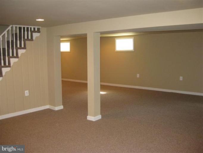 408 Hannes Street Silver Spring, MD 20901 - Photo 8 of 10 an empty room with windows & entryway