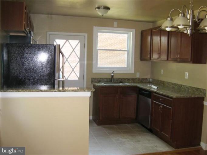 408 Hannes Street Silver Spring, MD 20901 - Photo 10 of 10 a kitchen with a sink and a window
