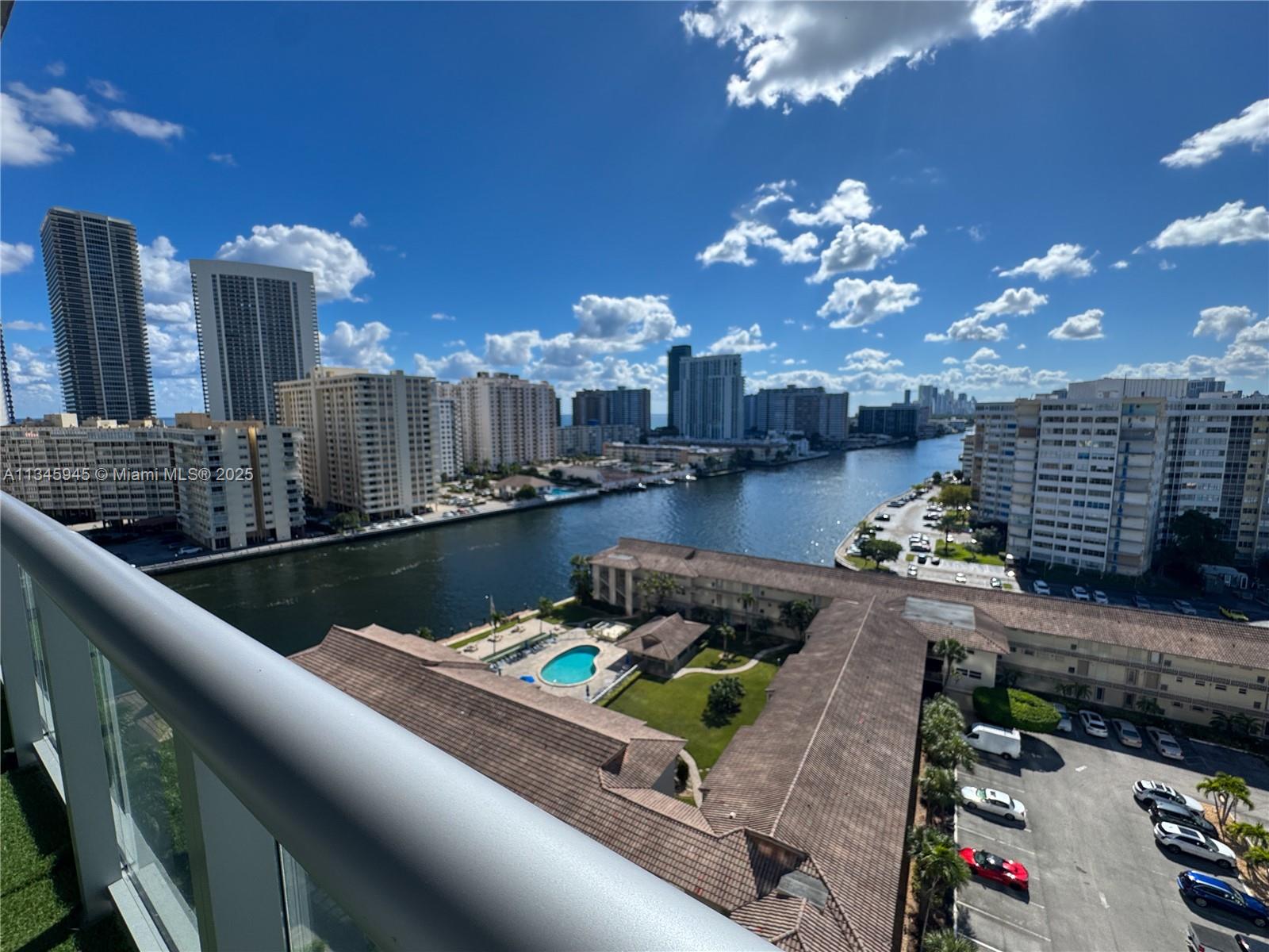 2602 East Hallandale Beach Boulevard, Unit R1409 Hallandale Beach, FL 33009 - Photo 13 of 32 a view of a balcony with dining table and chairs
