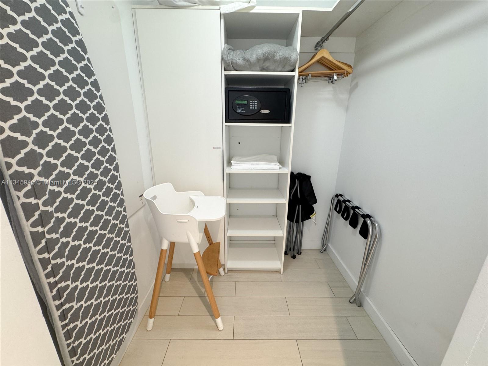 2602 East Hallandale Beach Boulevard, Unit R1409 Hallandale Beach, FL 33009 - Photo 15 of 32 a bathroom with a sink and a mirror