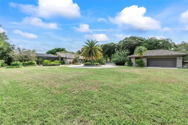 a room with two bed and a large window