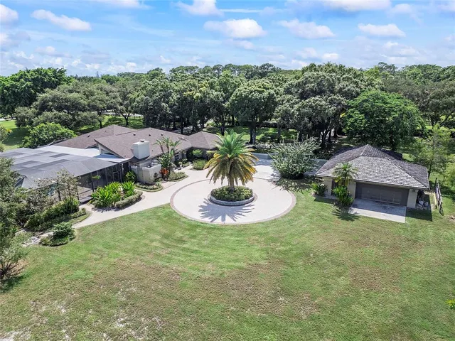 an aerial view of a house with garden