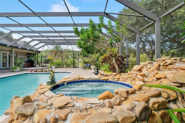 a room with painting and a potted plant