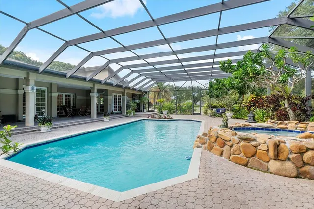 a view of a green field with an outdoor space