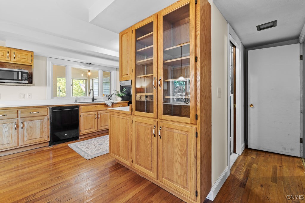 808 Velasko Road, Unit S Syracuse, NY 13207 - Photo 19 of 50 Kitchen area with custom glass hutch and hallway t