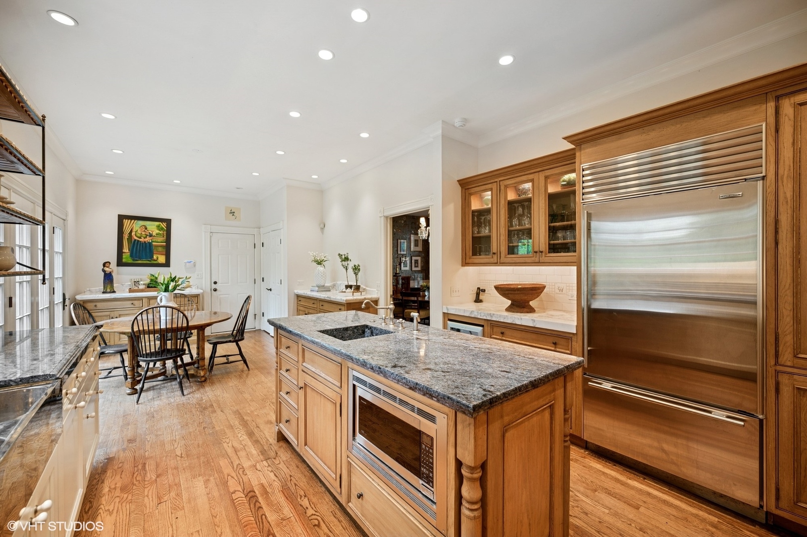 475 Maple Street Winnetka, IL 60093 - Photo 15 of 52 a kitchen with a stove and chairs