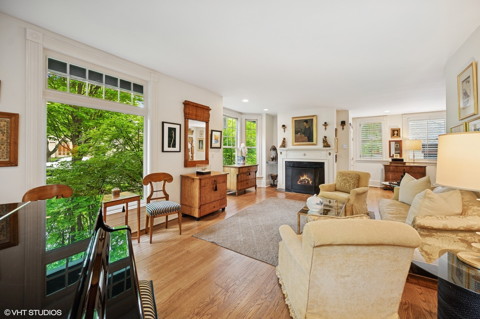 475 Maple Street Winnetka, IL 60093 - Photo 8 of 52 a living room with furniture large window and a fireplace