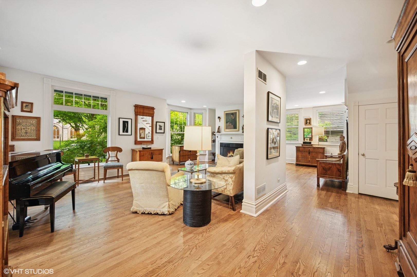 475 Maple Street Winnetka, IL 60093 - Photo 10 of 52 a living room with couches and kitchen view with wooden floor