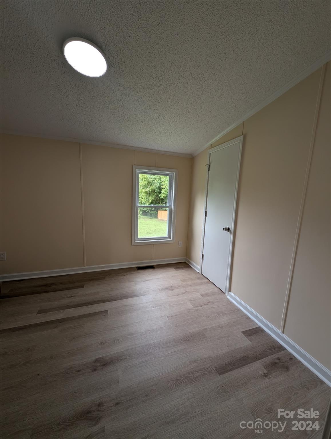 1450 Quarry Road Woodleaf, NC 27054 - Photo 16 of 23 an empty room with a fan & a window