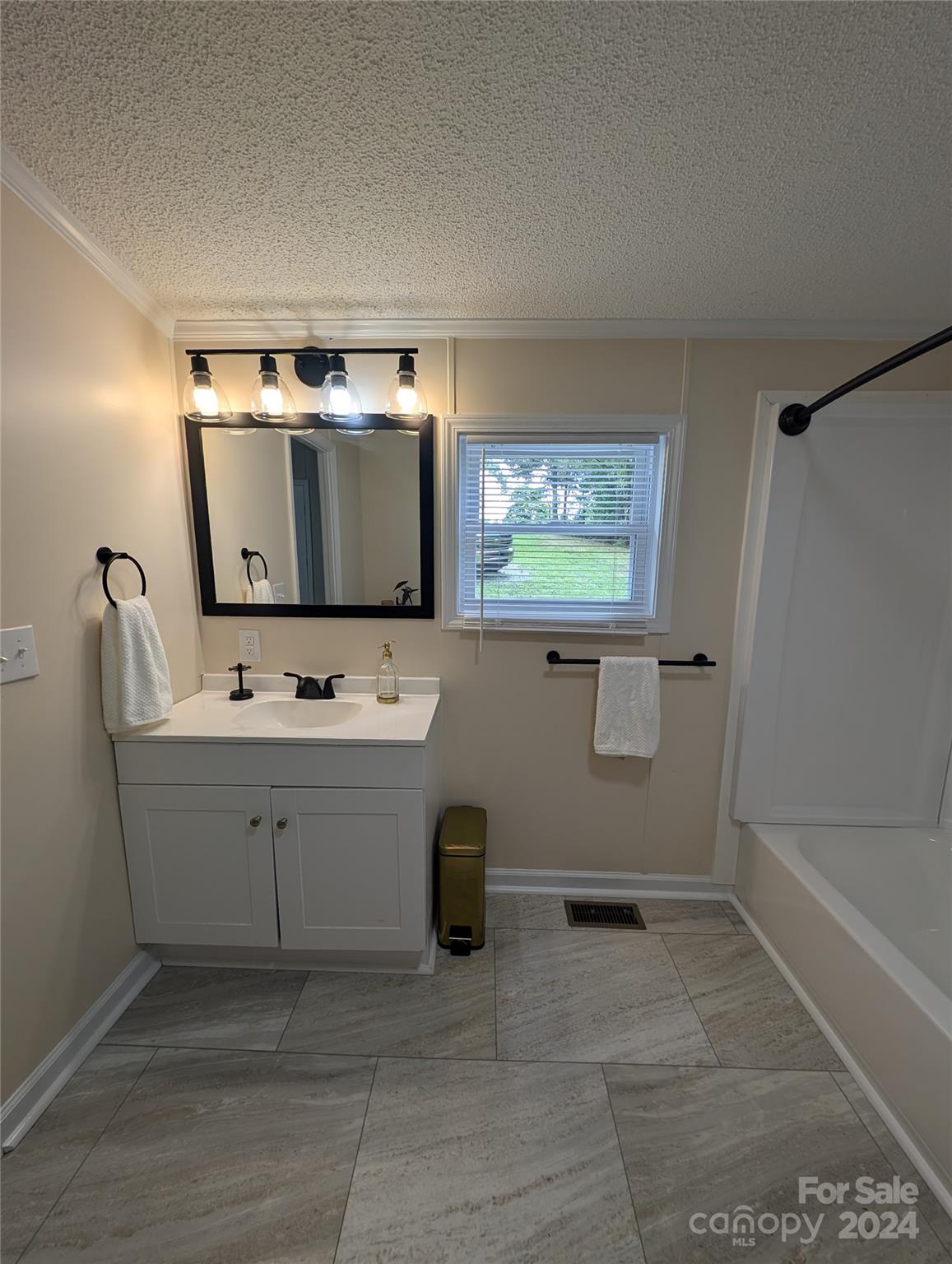1450 Quarry Road Woodleaf, NC 27054 - Photo 20 of 23 a bathroom with a sink and a mirror