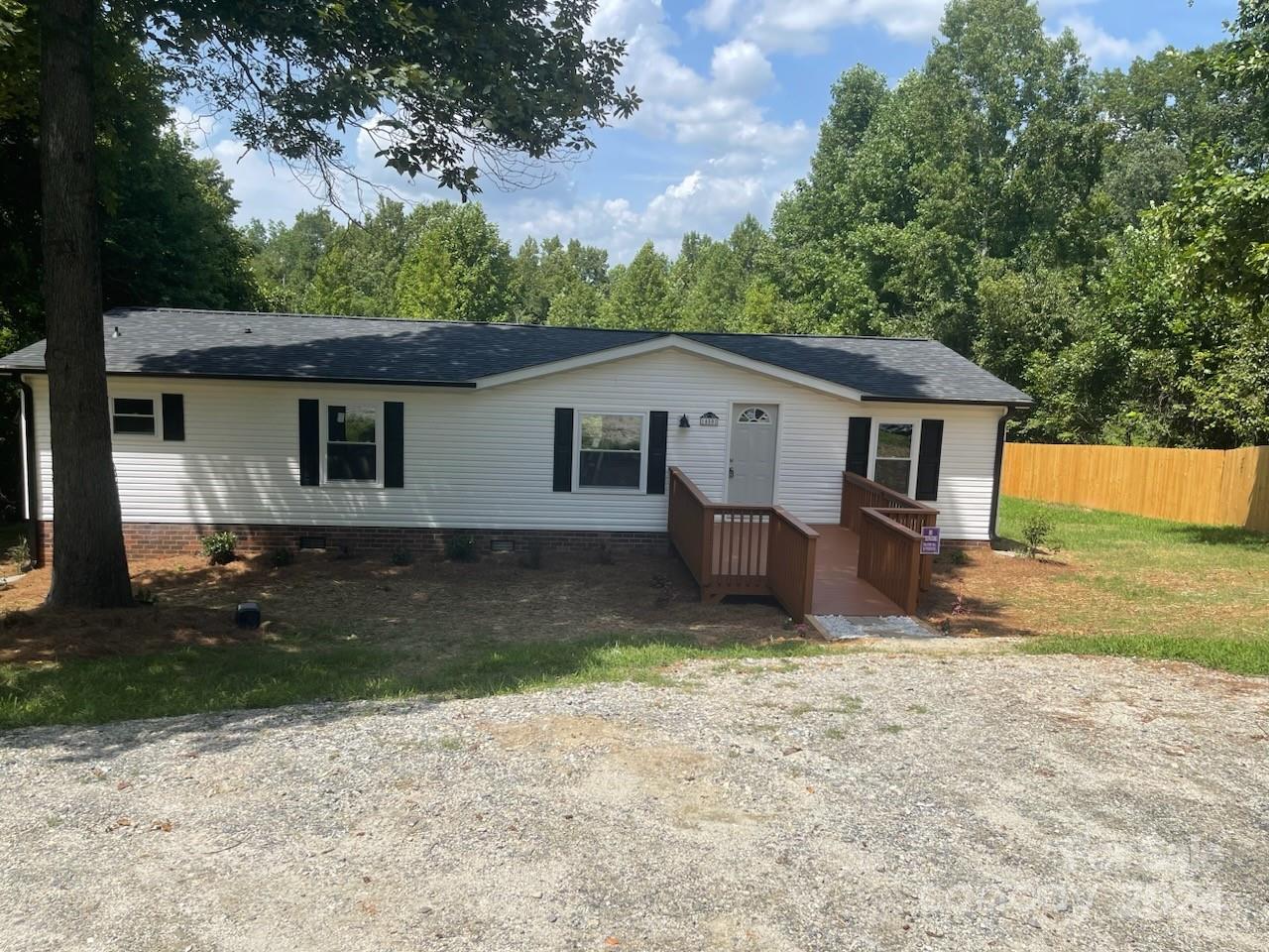 1450 Quarry Road Woodleaf, NC 27054 - Photo 2 of 23 a view of a house with a yard