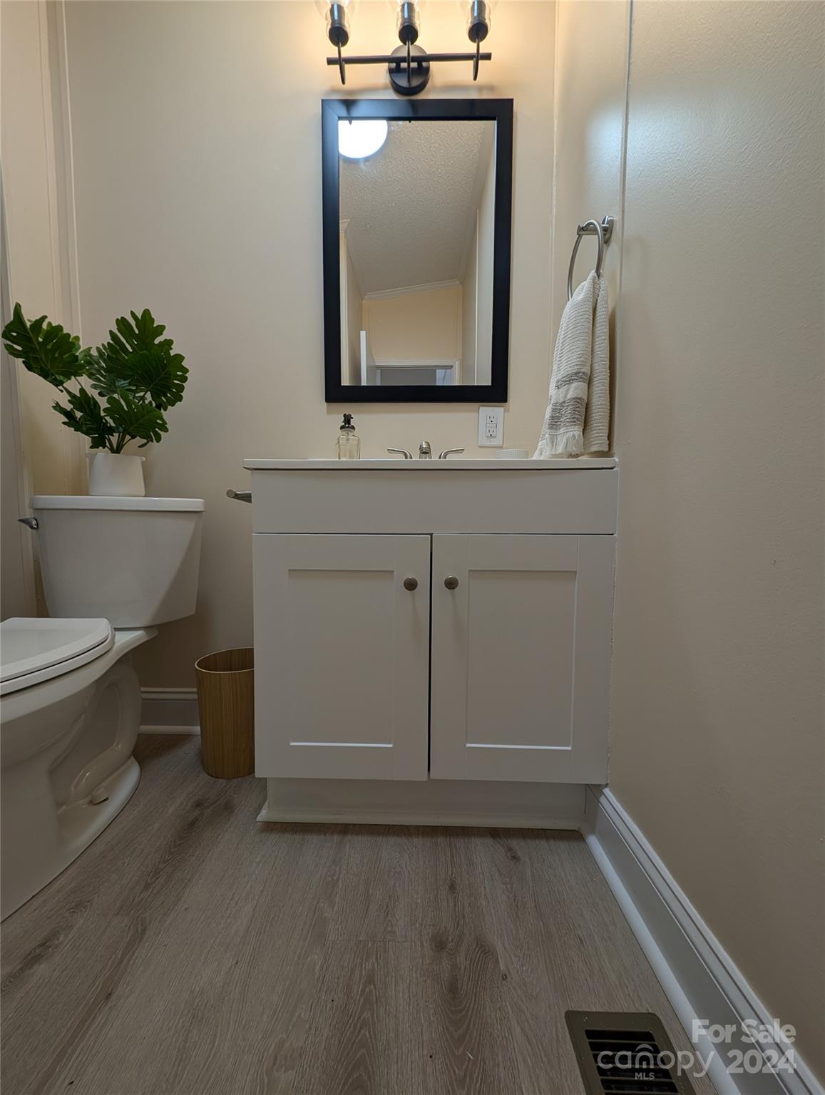 1450 Quarry Road Woodleaf, NC 27054 - Photo 22 of 23 a bathroom with a toilet sink and mirror