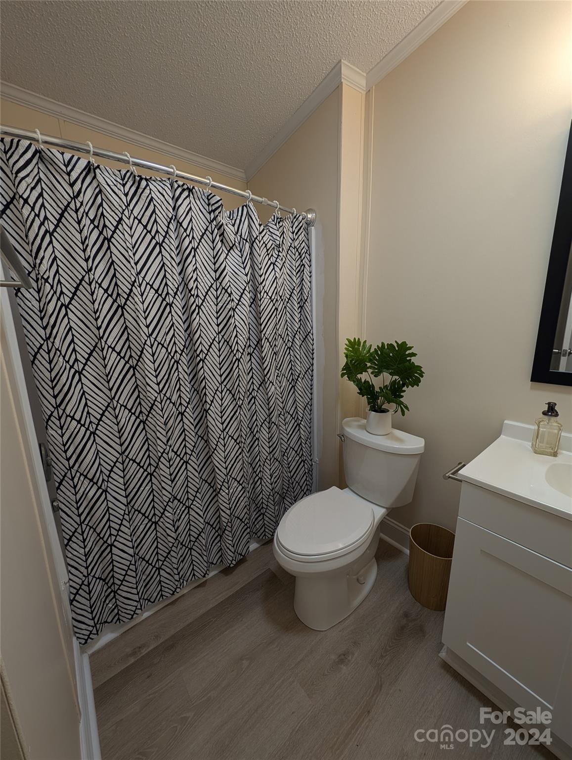 1450 Quarry Road Woodleaf, NC 27054 - Photo 23 of 23 a bathroom with a sink toilet and a mirror