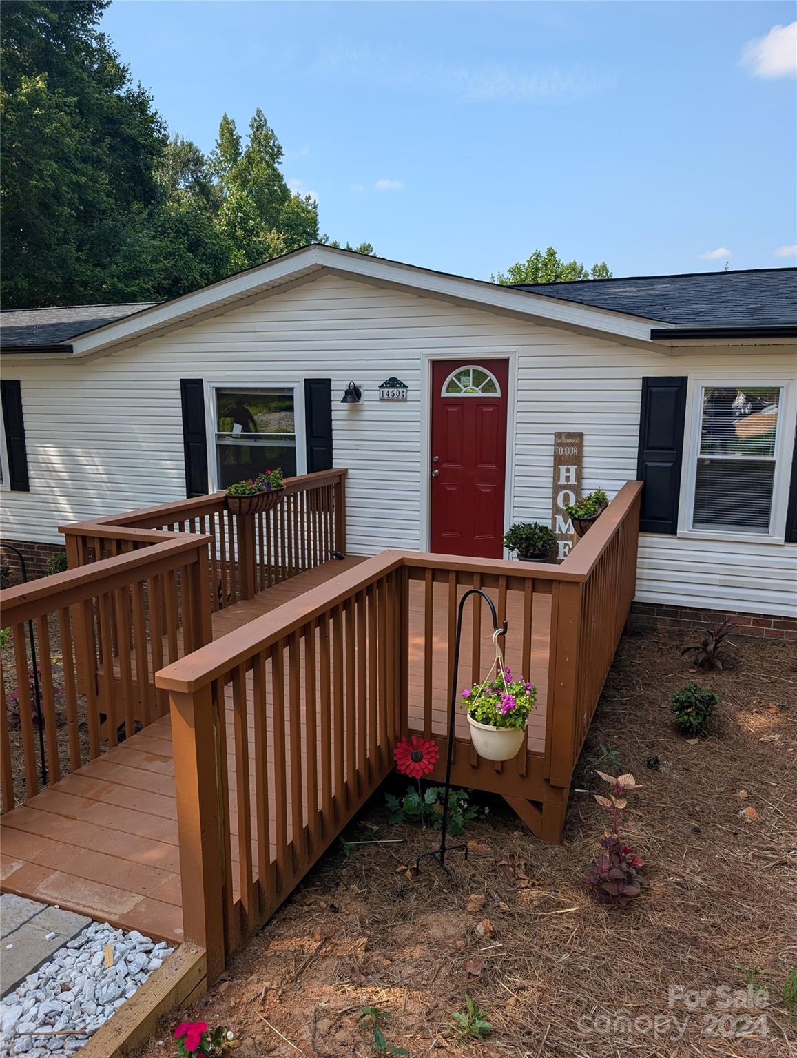 1450 Quarry Road Woodleaf, NC 27054 - Photo 4 of 23 a view of a house with wooden fence