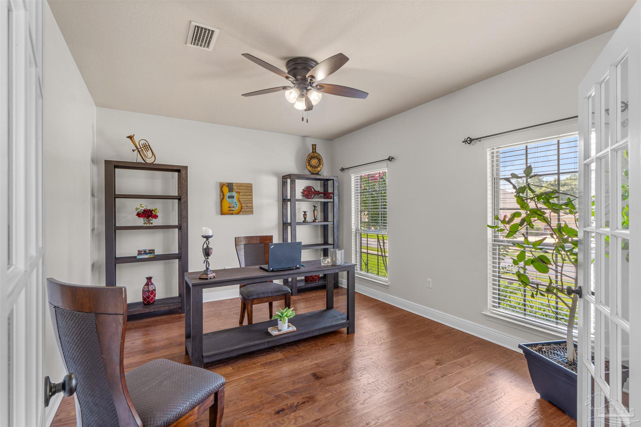 2698 Tulip Hill Road Pace, FL 32571 - Photo 12 of 65 a living room with furniture and a window