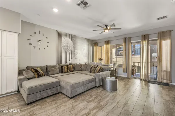 a living room with furniture and a large window