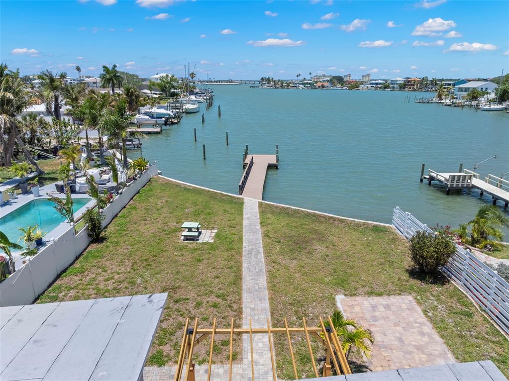 708 Sunset Cove Madeira Beach, FL 33708 - Photo 52 of 61 a view of a lake with a outdoor seating