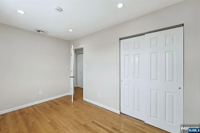 a bathroom with a sink toilet a mirror and bathtub