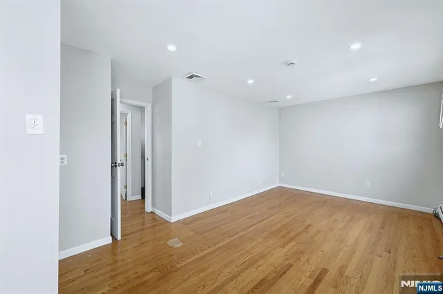 a view of a house with backyard and porch