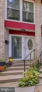 a small pool on the side of the brick building