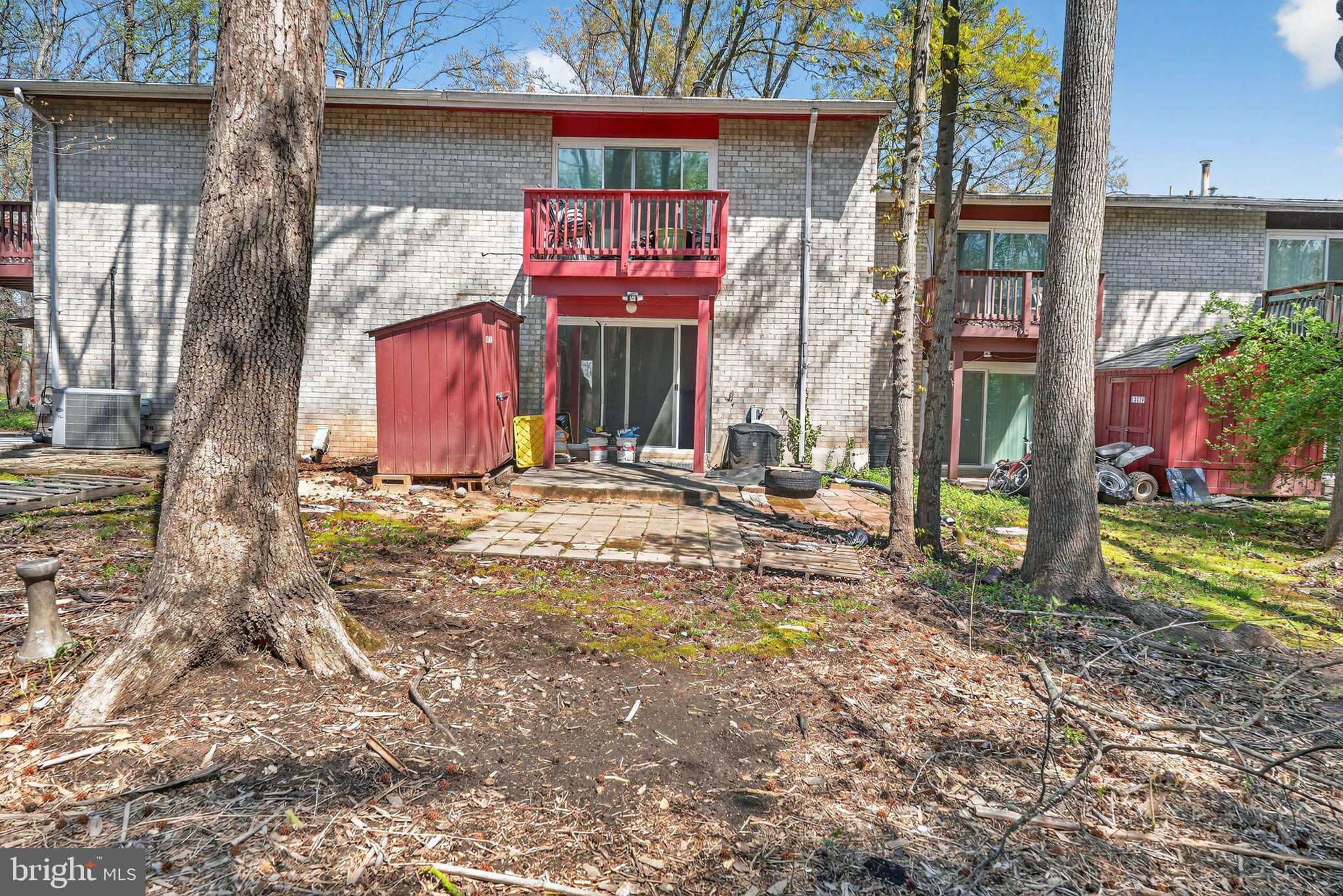 8587 Seasons Way, Unit 6B Lanham, MD 20706 - Photo 14 of 17 a front view of a house with garden
