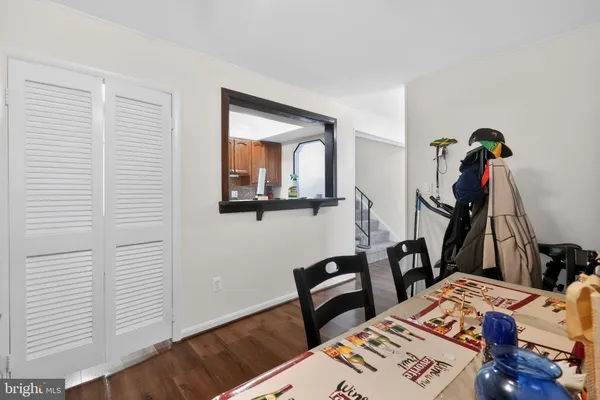 a view of an entryway with wooden floor