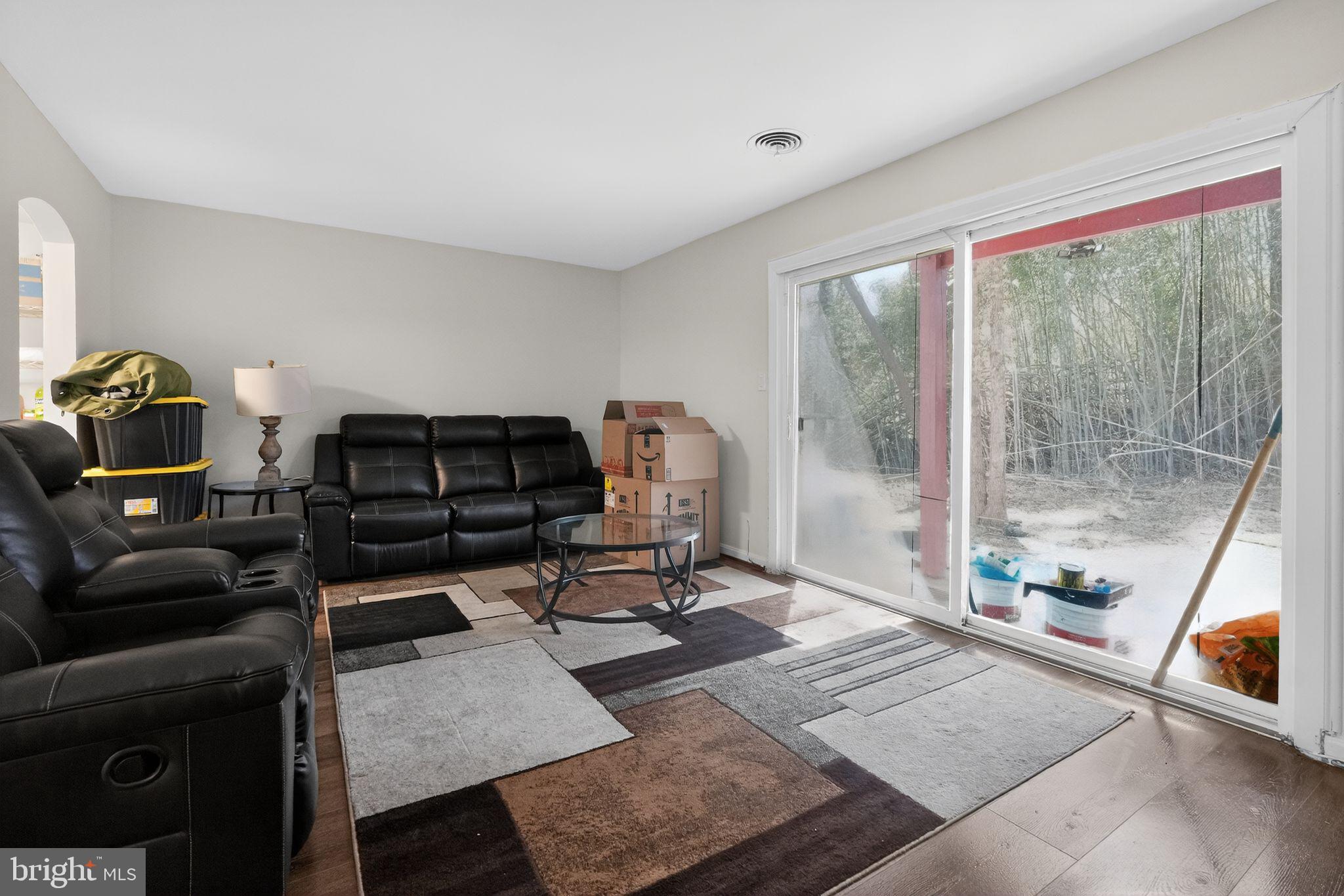 8587 Seasons Way, Unit 6B Lanham, MD 20706 - Photo 3 of 17 a living room with furniture and a floor to ceiling window