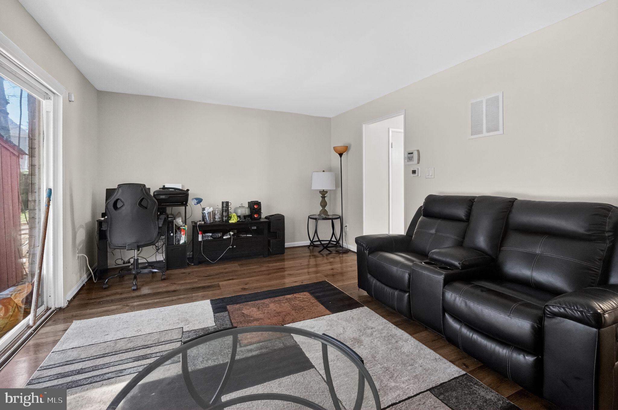 8587 Seasons Way, Unit 6B Lanham, MD 20706 - Photo 4 of 17 a living room with furniture