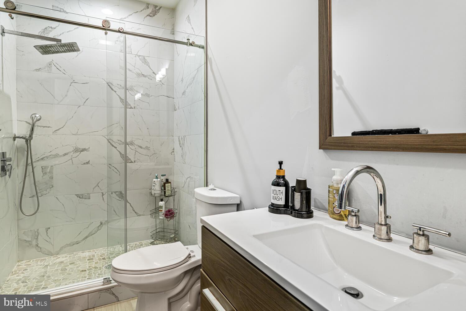 1214 South 20th Street Philadelphia, PA 19146 - Photo 13 of 34 a bathroom with a sink toilet and shower