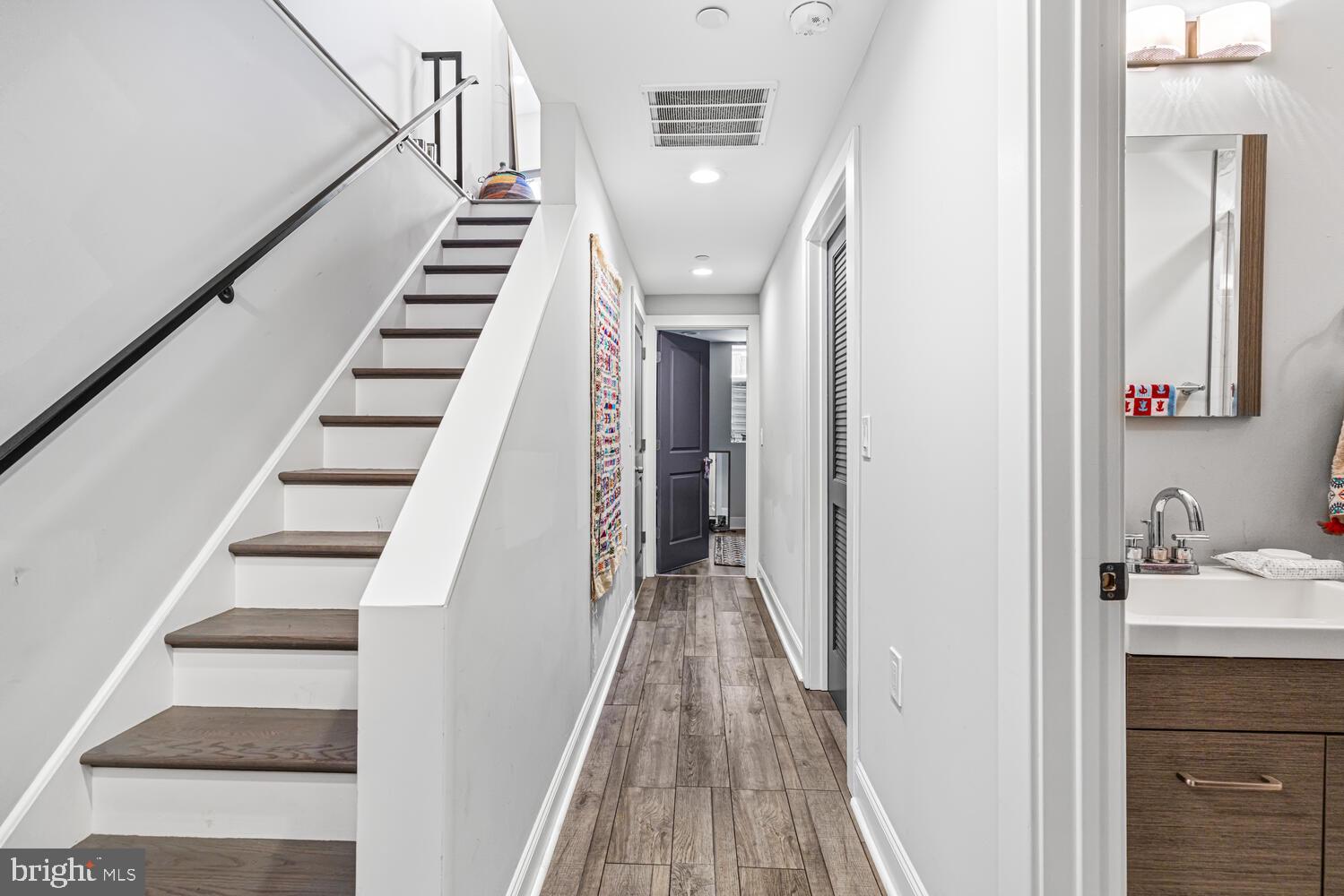 1214 South 20th Street Philadelphia, PA 19146 - Photo 22 of 34 a view of a hallway with wooden floor and entryway