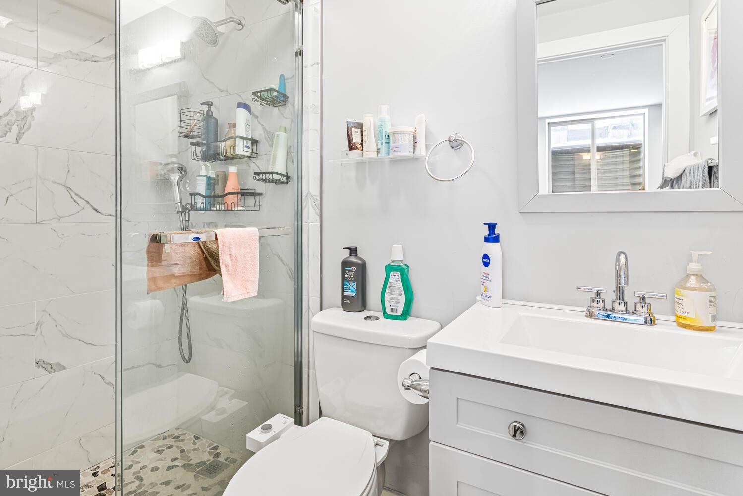 1214 South 20th Street Philadelphia, PA 19146 - Photo 28 of 34 a bathroom with a sink vanity mirror and toilet