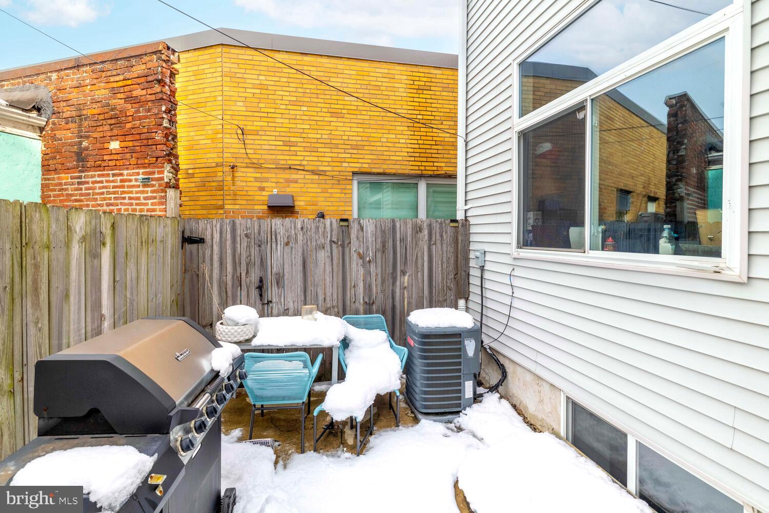 1214 South 20th Street Philadelphia, PA 19146 - Photo 34 of 34 a backyard of a house with a table and chairs
