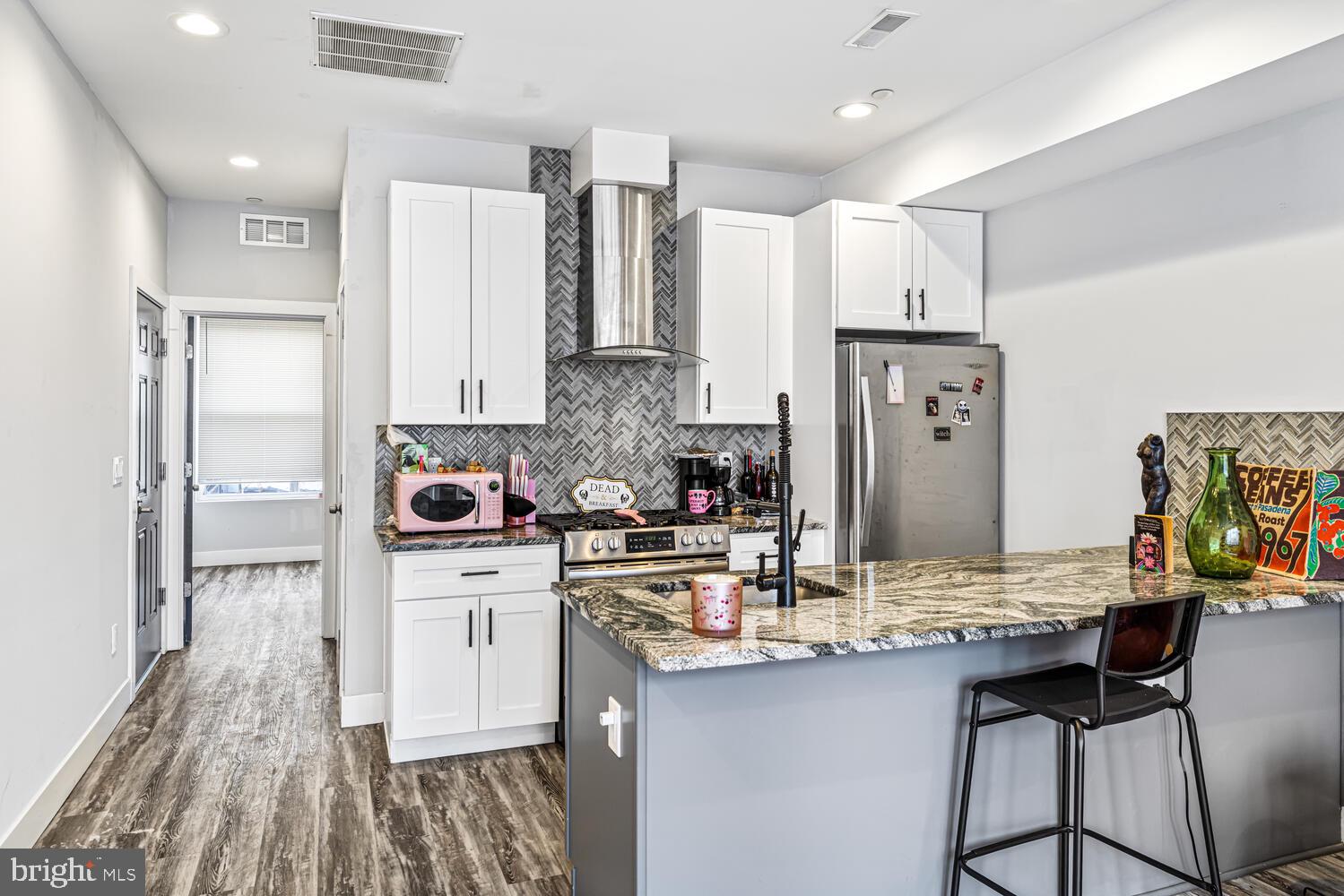 1214 South 20th Street Philadelphia, PA 19146 - Photo 6 of 34 a kitchen with stainless steel appliances a sink refrigerator and cabinets