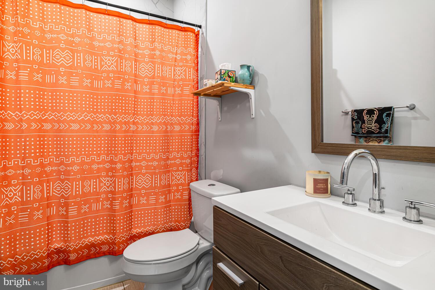 1214 South 20th Street Philadelphia, PA 19146 - Photo 10 of 34 a bathroom with a sink a toilet and shower curtain