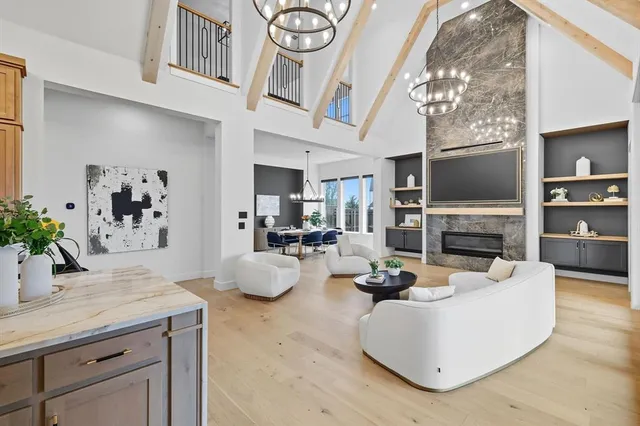 a living room with fireplace furniture and a flat screen tv