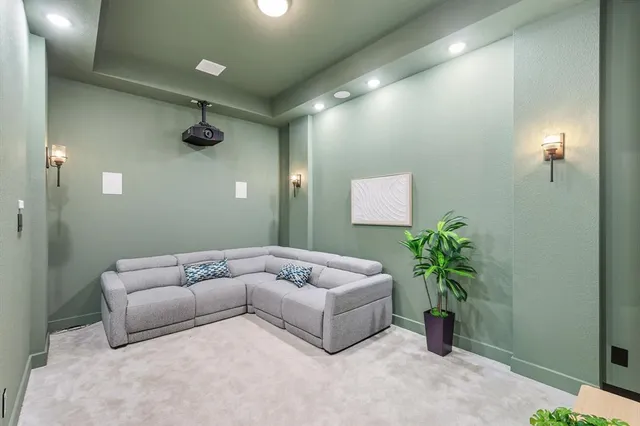 a view of a kitchen with stainless steel appliances kitchen island granite countertop a refrigerator a stove and a sink with cabinets