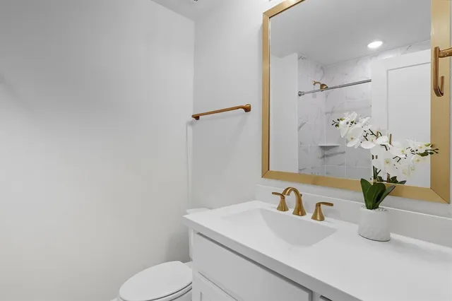 a bathroom with a toilet and a sink