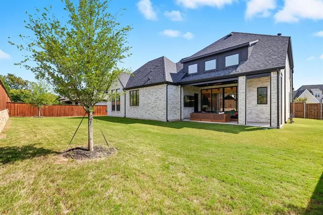 a bathroom with a granite countertop sink mirror vanity and toilet