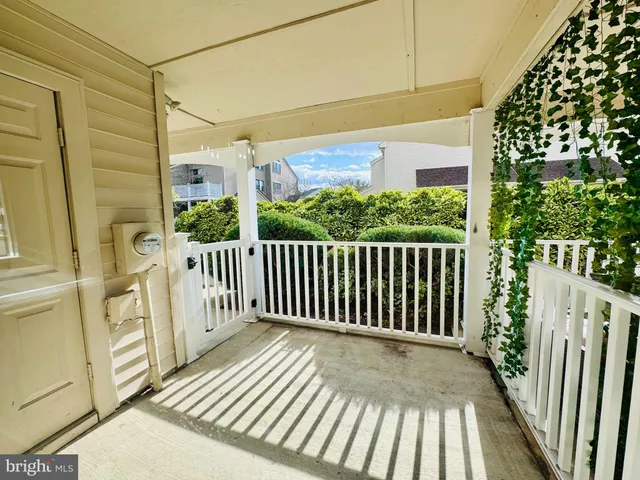 a view of a balcony with wooden floor