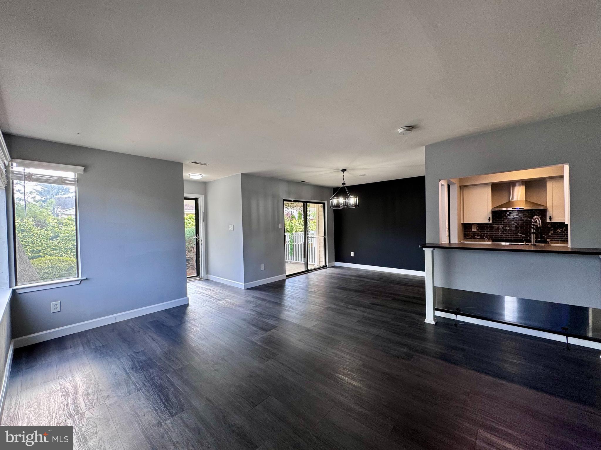 1403 Roberts Way Voorhees, NJ 08043 - Photo 10 of 22 a view of an empty room with a window and wooden floor