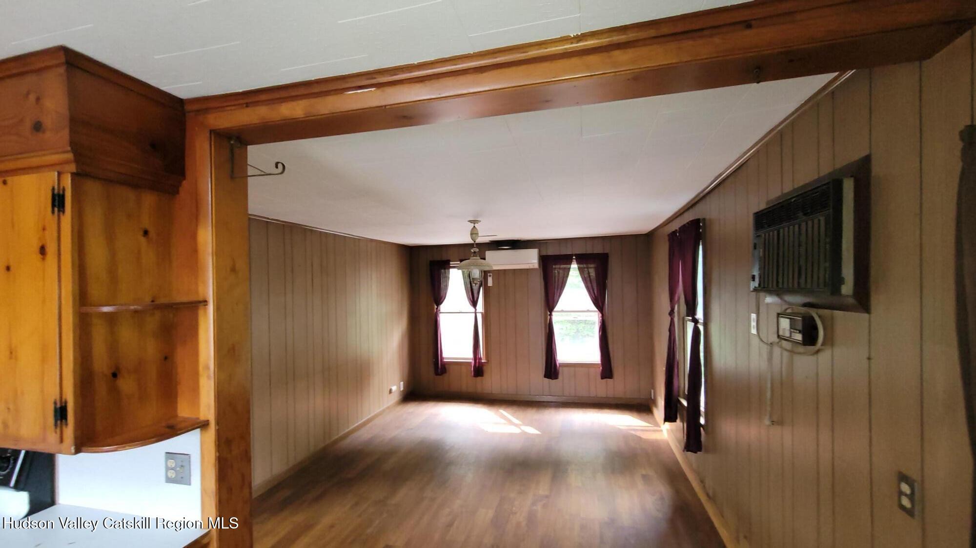 6074 Rte 9W Catskill, NY 12414 - Photo 12 of 15 a view of empty room with wooden floor and fan