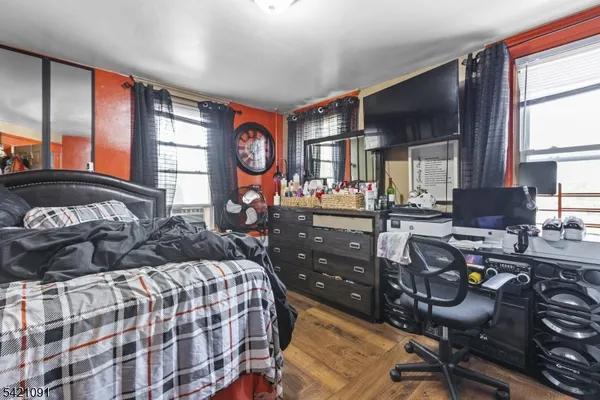 a bed sitting in a room next to a window