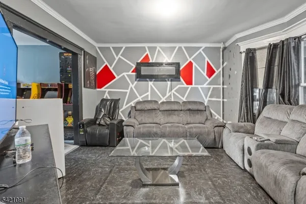 a living room with furniture and a ceiling fan