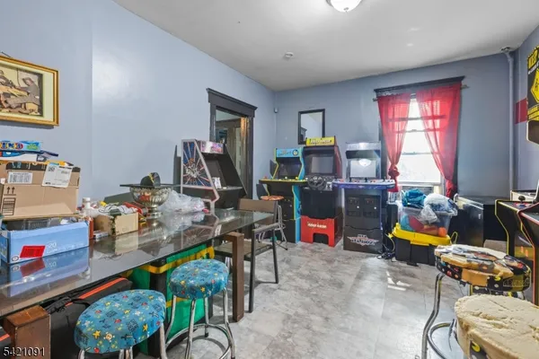 a view of a dining room with furniture and kitchen