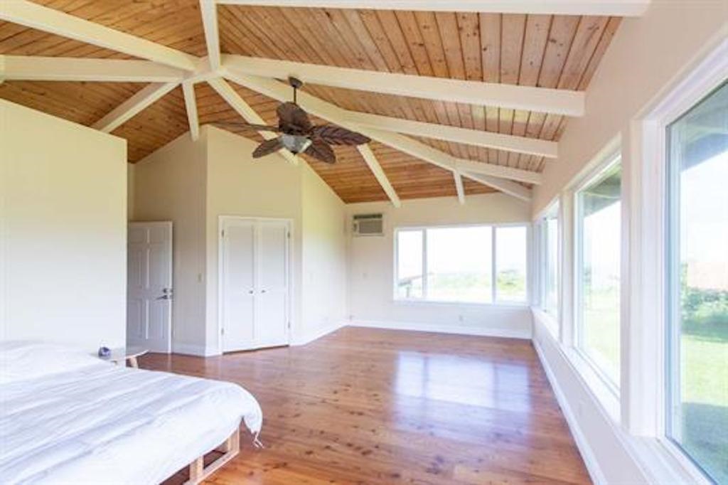 342 Kulike Road Haiku, HI 96708 - Photo 8 of 21 a bedroom with a bed and a window
