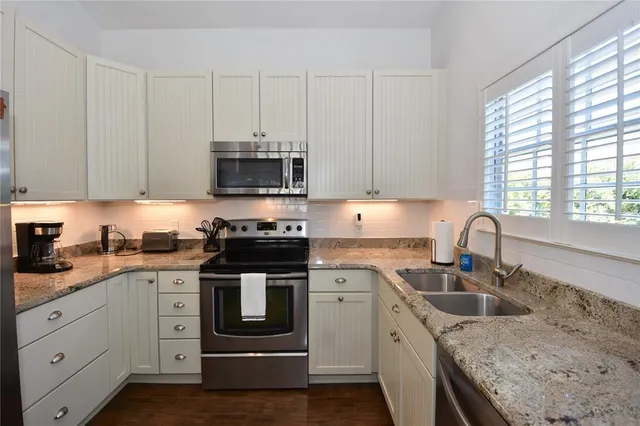 a kitchen with a sink and cabinets