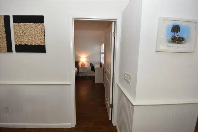 a bed room with a bed window and a chair